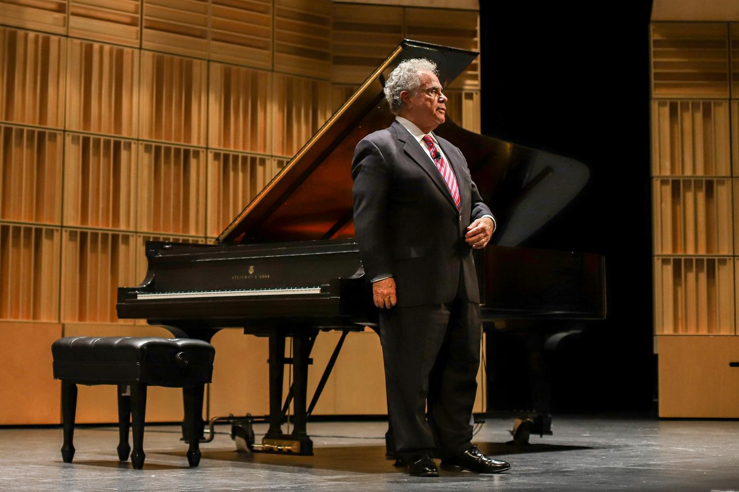 Jeffrey Siegel on stage in front of a piano